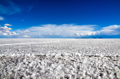 Scenic view of landscape against blue sky