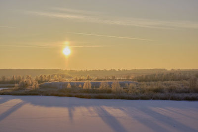 Scenic view of landscape against sky during sunset