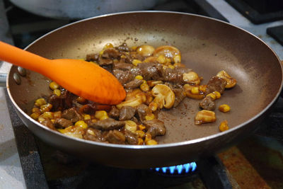 High angle view of food in cooking pan on stove