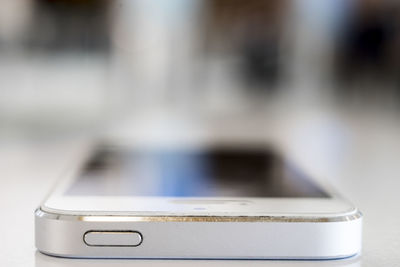 Close-up of mobile phone on table