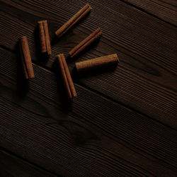 High angle view of nails on wooden table