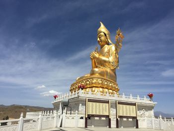 Low angle view of statue against building