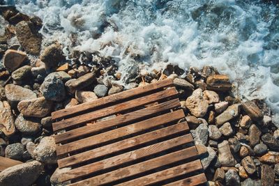 High angle view of rocks at sea shore