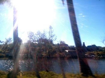 Scenic view of lake and trees against sky