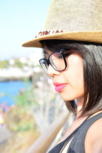 Close-up portrait of woman wearing hat