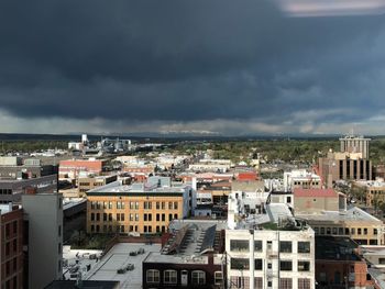 High angle view of buildings in city against sky