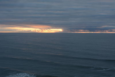 Scenic view of sea against sky at sunset