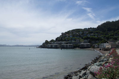 View of town against cloudy sky