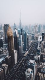 Distant view of burj khalifa amidst cityscape