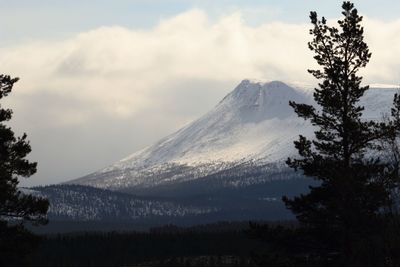 Scenic view of mountains against sky during winter