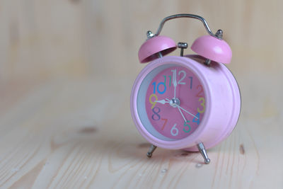 Close-up of clock on table