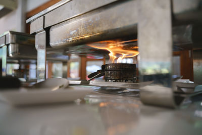 Close-up of lit tea light candles in restaurant