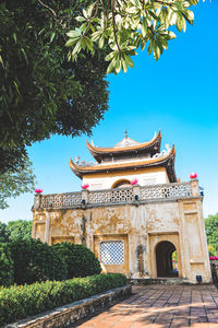 Low angle view of building against blue sky