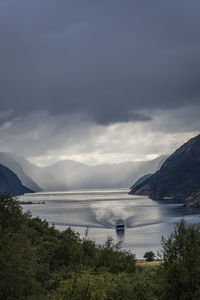 Scenic view of fjord against sky