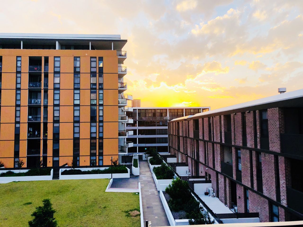 BUILDINGS AGAINST SKY AT SUNSET