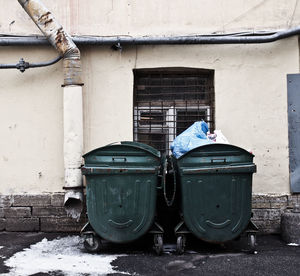 Garbage bin against buildings