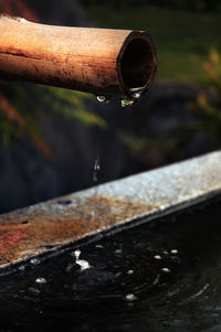 Close-up of water falling from pipe