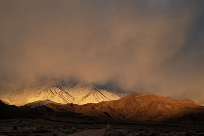 First morning sunlight lights up snowy mountains