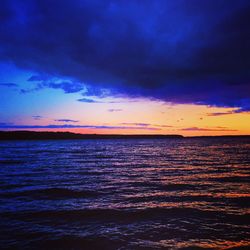 Scenic view of sea against dramatic sky