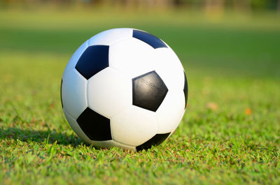 Close-up of soccer ball on field