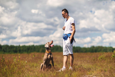 Full length of dog on field