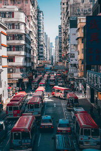 Aerial view of vehicles in traffic on street amidst buildings 