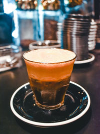Close-up of coffee served on table
