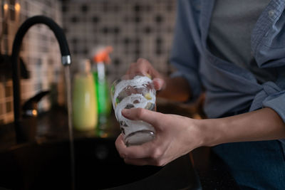 Midsection of person holding ice cream