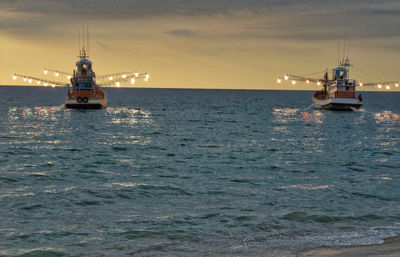 Sailboat sailing on sea against sky