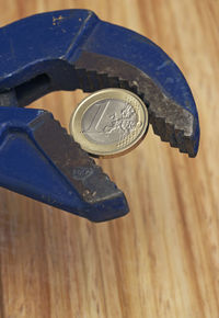 High angle view of coin on table