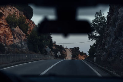 Road seen through car windshield