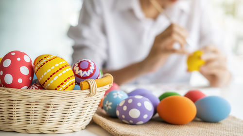 Close-up of multi colored balls in basket