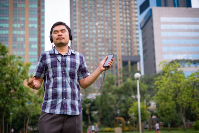 Full length of man standing in city