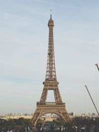 Crowd at eiffel tower against sky