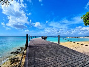 Pier over sea against sky