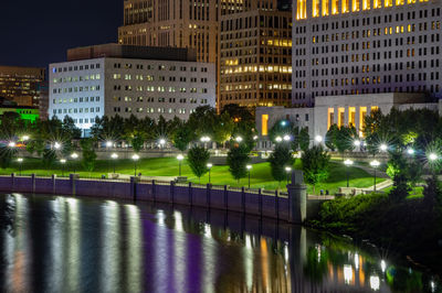 Illuminated buildings at waterfront