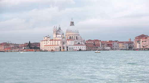 View of cathedral in sea against cloudy sky