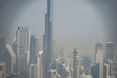 Modern buildings in city against sky