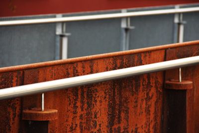 High angle view of metal railing against wall