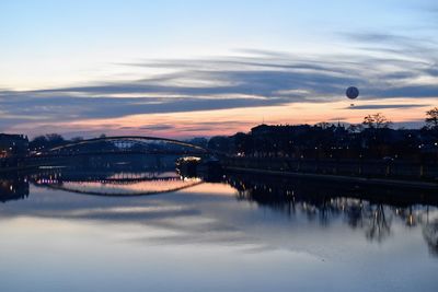 View of bridge over river against cloudy sky