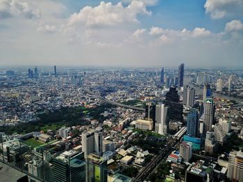 High angle view of modern buildings in bangkok against sky