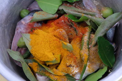 Close-up of turmeric on leaves in container