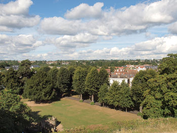 Panoramic view of trees and buildings against sky