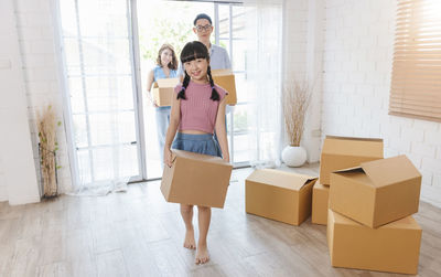 Portrait of a smiling young woman on floor