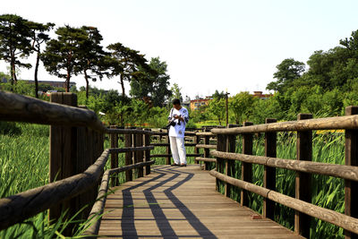 People walking on footbridge