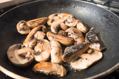 Close-up of meat in cooking pan
