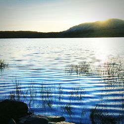 Scenic view of lake against sky during sunset