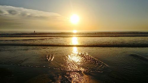 Scenic view of sea against sky at sunset