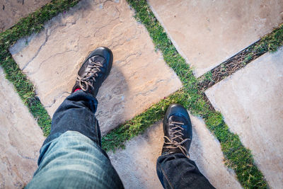 Low section of man standing outdoors