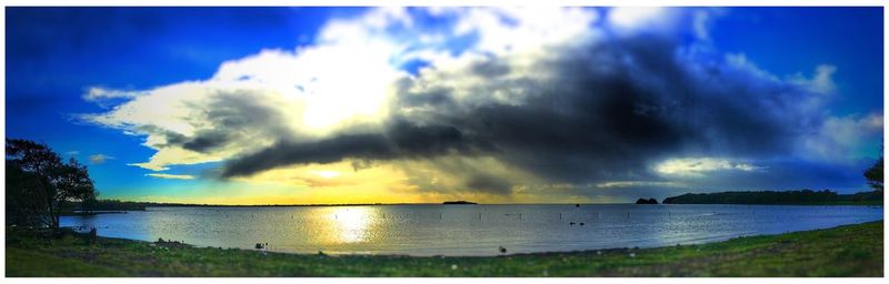 Panoramic view of sea against sky during sunset